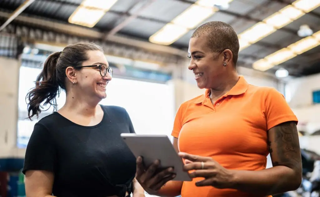 Worker and supervisor smiling at each other
